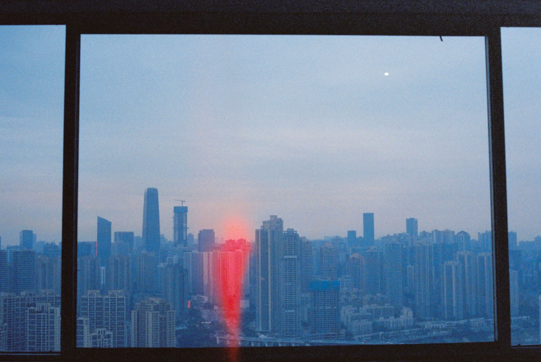 Warm office with city view at dusk